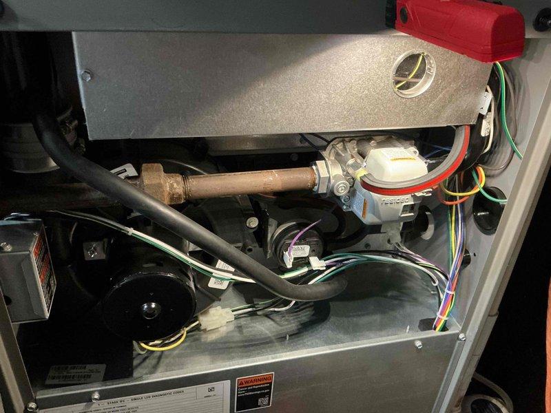 Performed annual furnace maintenance on 1-year-old natural gas system. Inspected all interior components including electrical connections, gas line, and motor assembly. Verified proper operation of safety switches and sensors. System is functioning within normal parameters with no issues identified.