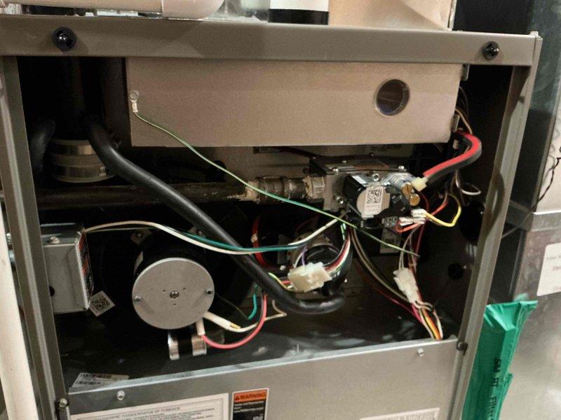 Performed scheduled furnace tune-up service. Conducted comprehensive inspection of system components including electrical connections, gas valve, and control module. Checked terminal wiring connections and verified proper operation of safety systems. Water heater was also observed in the utility area but was not part of this maintenance service.