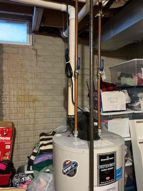 Performed scheduled furnace tune-up service. Conducted comprehensive inspection of system components including electrical connections, gas valve, and control module. Checked terminal wiring connections and verified proper operation of safety systems. Water heater was also observed in the utility area but was not part of this maintenance service.