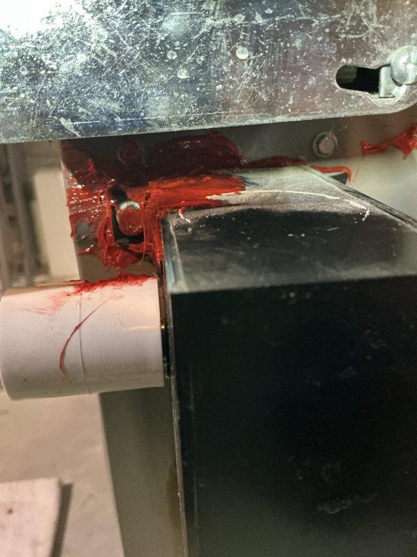 Performed routine furnace maintenance under annual contract. Identified red sealant leakage at pipe connections and degraded orange gasket material with condensation present on control housing. Applied fresh sealant and replaced deteriorated gasket to prevent future leaks and ensure proper system operation.