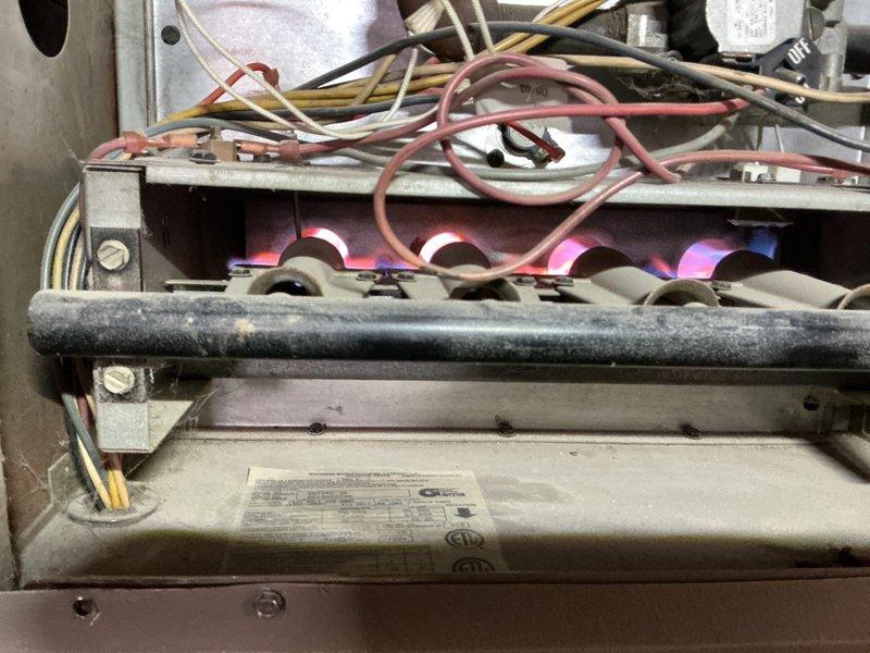 Responded to no heat call for 2002 Goodman furnace. Inspected unit and found system operational with proper combustion visible at burners. Checked flame sensor, ignition sequence, and blower motor functionality. Performed visual inspection of condensate drainage system and electrical connections. Customer advised that furnace is nearing end of expected service life; provided quote for replacement unit as requested.