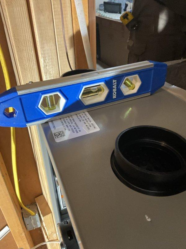Installed new furnace unit and verified proper leveling using carpenter's level on both horizontal and vertical planes. Completed connection of electrical wiring and internal components. Unit is operational with proper airflow through ventilation system.