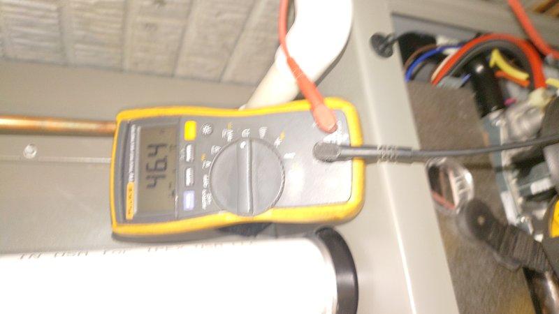 Performed scheduled heating maintenance service. Conducted electrical diagnostics using multimeter showing 494 reading, and verified system temperature parameters with digital measurement device showing 00.6/13°F readings. All components tested within normal operating parameters.