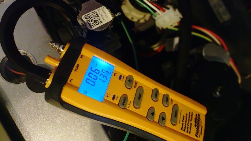 Performed scheduled heating maintenance service. Conducted electrical diagnostics using multimeter showing 494 reading, and verified system temperature parameters with digital measurement device showing 00.6/13°F readings. All components tested within normal operating parameters.