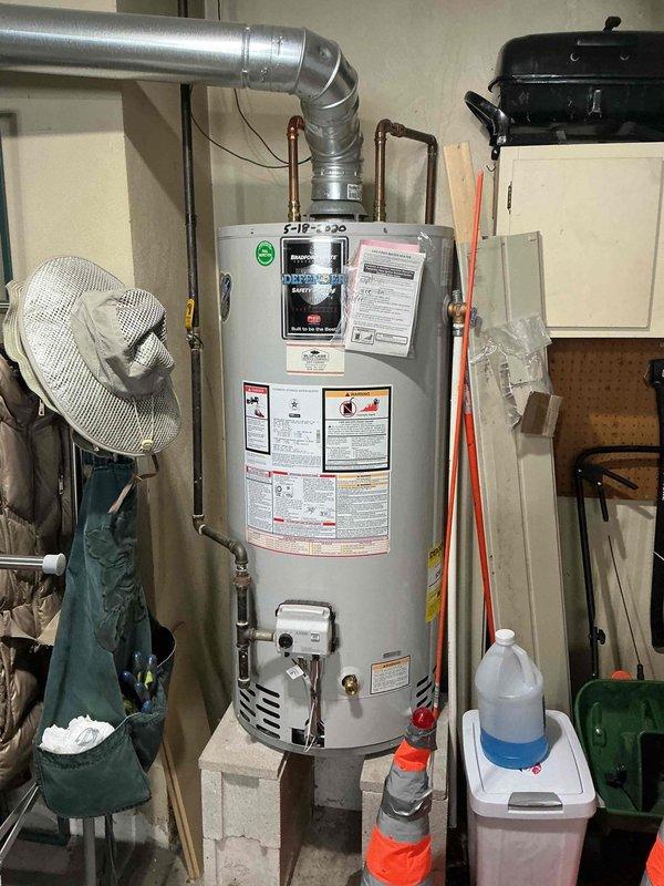 Performed routine maintenance on a 6-year-old furnace. Inspected blower motor assembly and electrical connections, confirming proper wire routing and secure connections. Examined water heater installation and ventilation system to ensure safe operation and proper clearances. All components tested and functioning correctly.