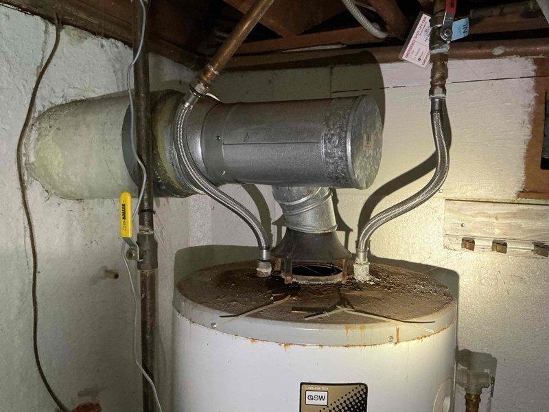 Performed routine maintenance on 5-year-old furnace. Inspected hot water heater installation, noting proper ventilation connections and flexible metal connectors to plumbing system. Conducted visual inspection of heat exchanger using camera system, identifying minor discoloration on metal components that remains within normal operating parameters.