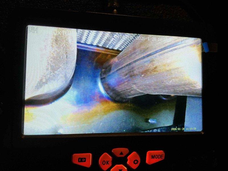 Performed routine maintenance on 5-year-old furnace. Inspected hot water heater installation, noting proper ventilation connections and flexible metal connectors to plumbing system. Conducted visual inspection of heat exchanger using camera system, identifying minor discoloration on metal components that remains within normal operating parameters.