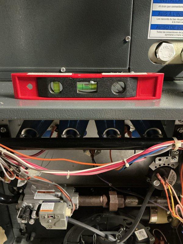 Performed scheduled heating maintenance service on furnace system. Conducted leveling check on critical components using spirit level to ensure proper equipment alignment. Inspected and verified electrical connections, confirming proper wire routing and secure terminal connections.