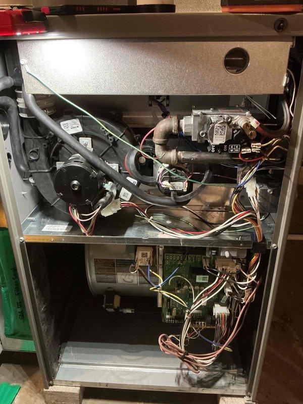 Performed routine maintenance on natural gas furnace. Inspected internal components including blower motor assembly, circuit board, and wiring connections. Checked ductwork and thermostat operation to ensure proper system functionality.