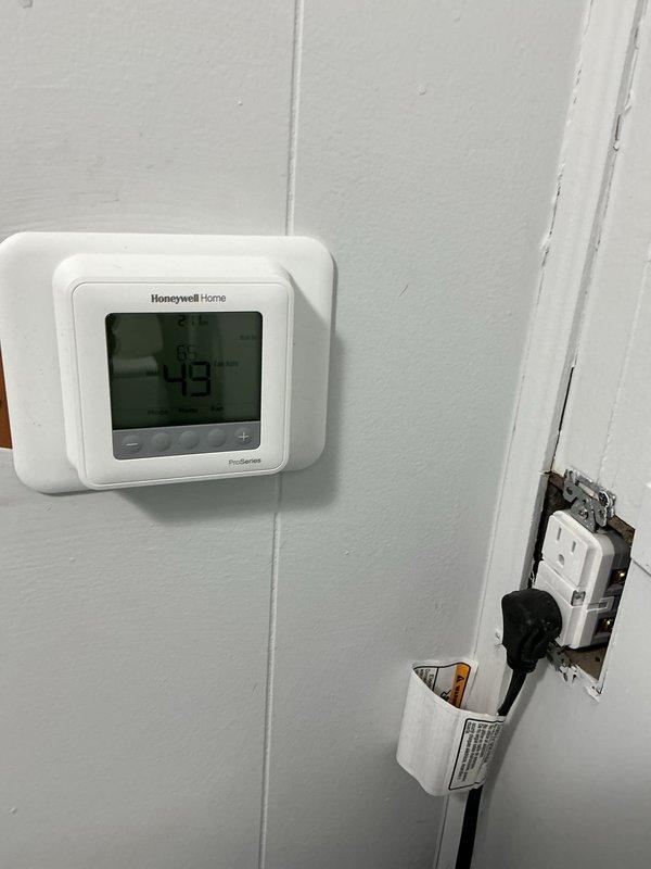 Responded to service call for gas furnace malfunction. Diagnosed system showing low temperature reading (49°F) on Honeywell ProSeries thermostat. Inspected and replaced dirty air filter which was restricting proper airflow, causing system inefficiency and potential overheating. Tested system operation after replacement to confirm proper heating function.