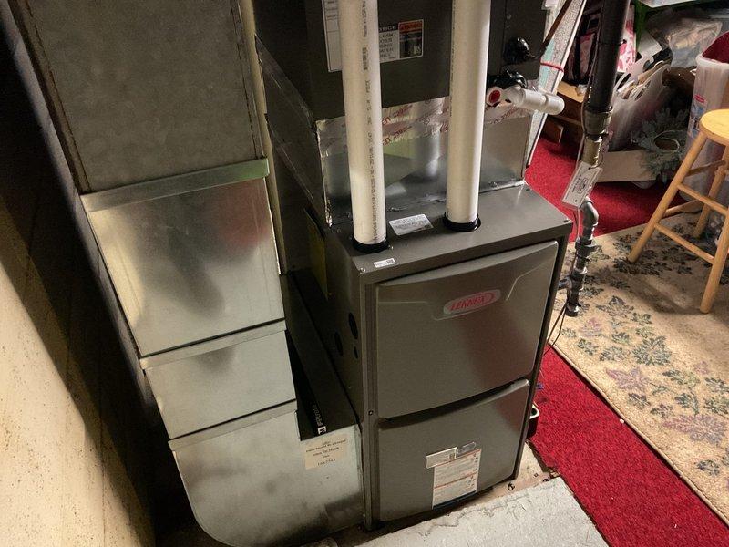 Successfully installed a high-efficiency Lennox 70 kBTU 96% up-flow furnace with proper leveling confirmed. Fabricated and installed metal spacer between coil and furnace, replaced approximately 35' of 2" cell core venting, and installed a new 40-gallon gas short water heater. Existing Nest thermostat was reconnected and system was verified operational.