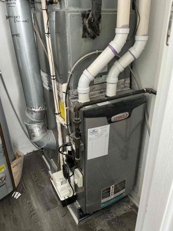 Performed scheduled furnace tune-up on Lennox heating system. Inspected combustion air intake/exhaust PVC piping, humidifier operation, and ductwork connections. Noted previous soot deposit on ducting, indicating possible past overheating issue, but system currently functioning properly. Customer advised to replace air filter as recommended.