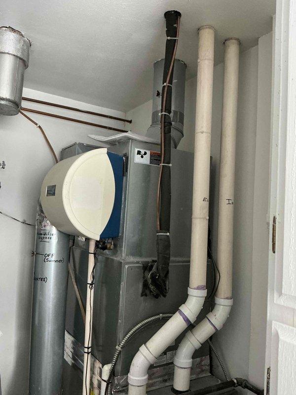 Performed scheduled furnace tune-up on Lennox heating system. Inspected combustion air intake/exhaust PVC piping, humidifier operation, and ductwork connections. Noted previous soot deposit on ducting, indicating possible past overheating issue, but system currently functioning properly. Customer advised to replace air filter as recommended.