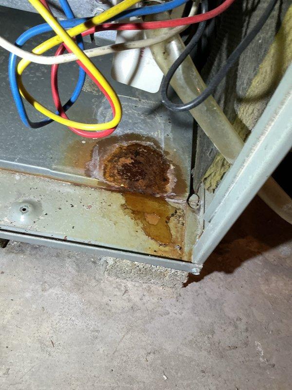 Diagnosed natural gas furnace not heating issue. Inspection revealed significant corrosion and water damage on electrical components, with advanced rust formation on metal casing. Found multiple affected wires and connections in the control compartment, indicating prolonged moisture exposure. Recommended replacement of damaged electrical components to restore proper heating function.