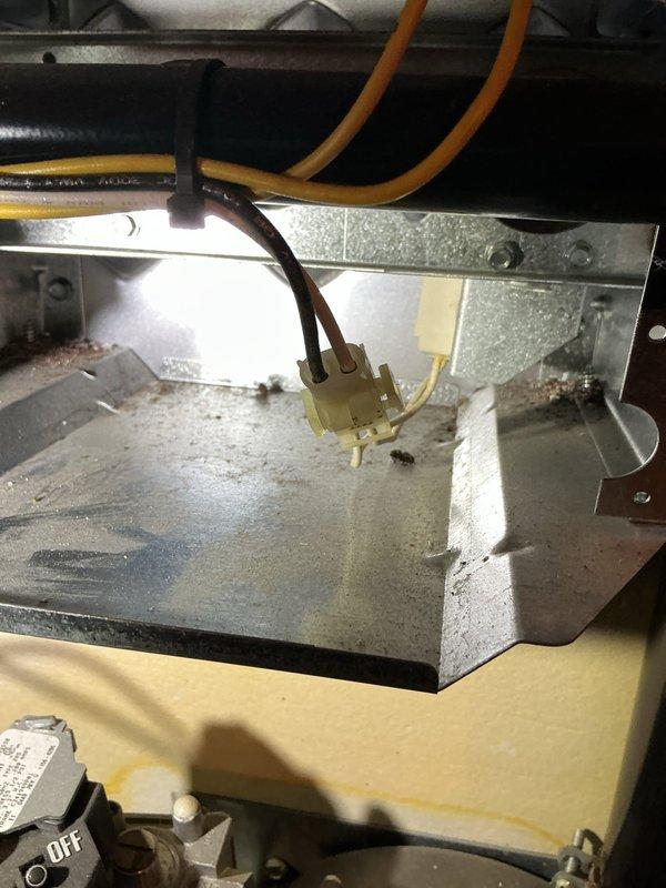 Diagnosed natural gas furnace not heating issue. Inspection revealed significant corrosion and water damage on electrical components, with advanced rust formation on metal casing. Found multiple affected wires and connections in the control compartment, indicating prolonged moisture exposure. Recommended replacement of damaged electrical components to restore proper heating function.