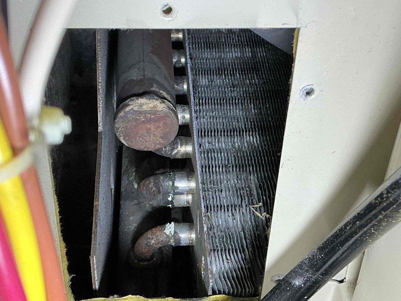 Responded to no heat call on natural gas furnace. Inspection revealed significant corrosion on heat exchanger components and combustion analysis with Testo 310 showed dangerous CO readings of 454 ppm with low O₂ levels (1.8%), indicating critical heat exchanger failure. Shut down unit for safety and advised customer replacement is necessary due to carbon monoxide hazard.