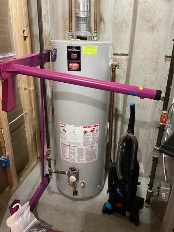 Replaced 20+ year old Bradford White 50-gallon standard vented hot water heater that was no longer providing sufficient hot water. Installed new unit with proper copper pipe connections and ensured proper venting through existing galvanized ductwork. System tested and functioning correctly with all connections secure.