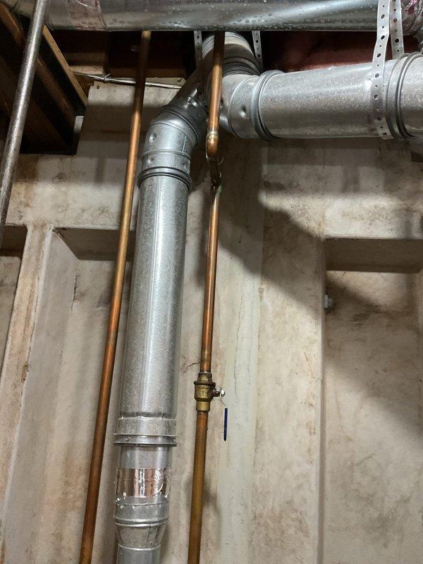 Replaced 20+ year old Bradford White 50-gallon standard vented hot water heater that was no longer providing sufficient hot water. Installed new unit with proper copper pipe connections and ensured proper venting through existing galvanized ductwork. System tested and functioning correctly with all connections secure.
