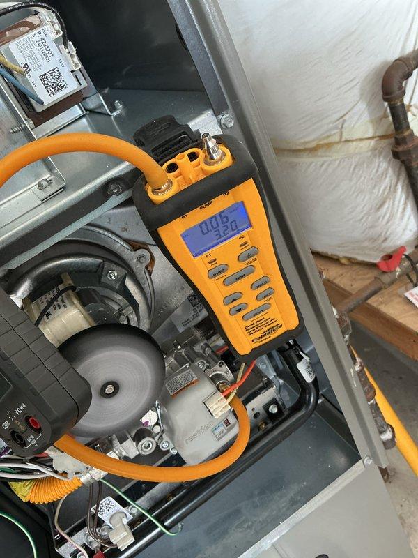 Performed annual heating maintenance service on customer's 1-year-old system. Conducted gas pressure testing with Fieldpiece digital manometer (reading 0.09" WC) and inspected gas valve assembly for proper operation. Visual inspection of blower wheel, electrical connections and control components showed all systems functioning within normal parameters.