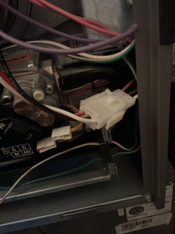 Performed diagnostic service on 13-year-old furnace experiencing ignition issues. Inspected electrical connections at junction box and control board, finding loose wire connections at the main control panel. Secured all connections and verified proper voltage to ignition system. Unit now firing correctly with normal operation confirmed through complete system test cycle.