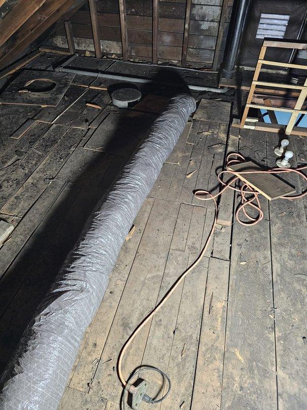 Successfully installed new furnace in spare bedroom with 5" filter rack and supply plenum. Connected system to existing gas line in crawl space that previously fed gravity furnace, and ran flex duct through attic to distribute conditioned air to living room (2), kitchen, bathroom, and bedroom. Completed installation with Honeywell T6 Pro thermostat for system control.