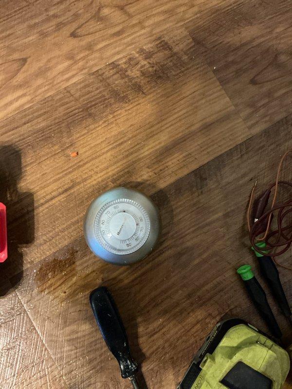 Replaced faulty upstairs thermostat with new digital programmable model. Removed old round dial-type thermostat, installed modern wall-mounted unit with digital interface and reconnected existing wiring to restore heating system functionality.