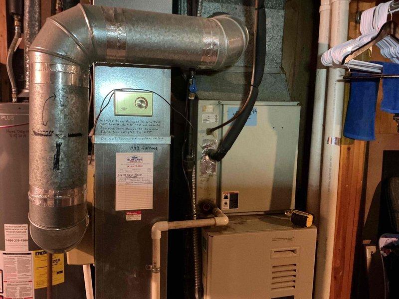 Responded to service call for non-functioning furnace and thermostat. Diagnosed 1993 furnace system located in basement utility room. Performed necessary repairs to restore heating functionality and verified proper operation of thermostat before completing service.