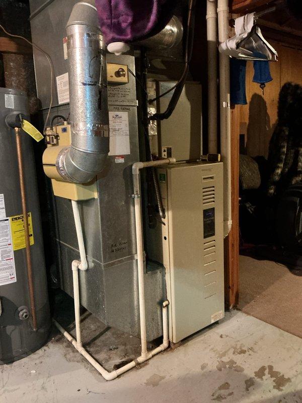 Responded to service call for non-functioning furnace and thermostat. Diagnosed 1993 furnace system located in basement utility room. Performed necessary repairs to restore heating functionality and verified proper operation of thermostat before completing service.