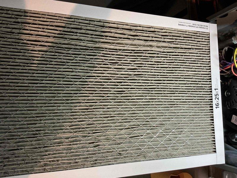 Performed comprehensive furnace tune-up service including inspection of the system components and replacement of the dirty 16 x 25 air filter. Examined the PVC venting system and ductwork connections for proper installation and function. Unit is operating within normal parameters after service completion.