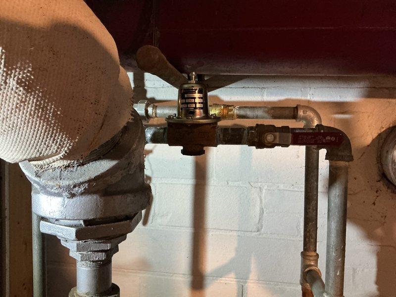 Performed complete hydronic system safety component upgrade including installation of new combination pressure reducing valve/backflow preventer, replacement of automatic air vent, and installation of new pressure relief valve. System was properly refilled, air purged from all zones, and full operational testing confirmed proper boiler system function with appropriate pressure regulation and protection components now in service.