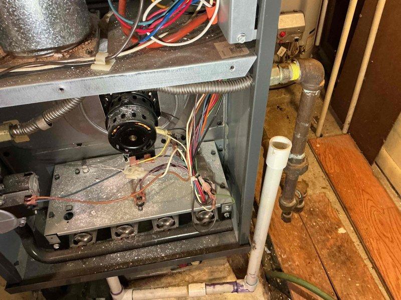 Performed diagnostic service call on gas furnace with reported exhaust system issues. Inspected PVC exhaust venting and identified necessary repairs. Accessed and examined furnace internal components including blower assembly, wiring connections, and gas line to complete required service work. Customer inquired about hot water tank but declined additional service.