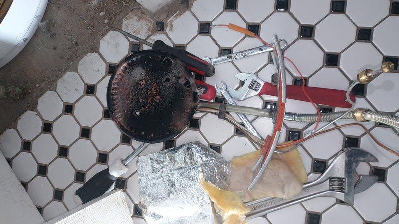 Performed diagnostic assessment on non-functioning hot water tank in century home. Identified corroded heating element and thermostat requiring replacement. Removed old components, installed new parts, and verified proper system operation with temperature testing. Water heater now functioning correctly with restored hot water supply.