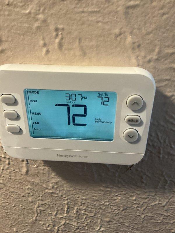 Performed routine maintenance on a 3-year-old gas furnace. Inspected electrical connections and wiring in the control compartment, confirming proper installation and condition. Verified thermostat functionality on the Honeywell Home digital unit, which is currently set to "Heat" mode with permanent hold at 72°F. Provided customer with replacement thermostat quote as requested.