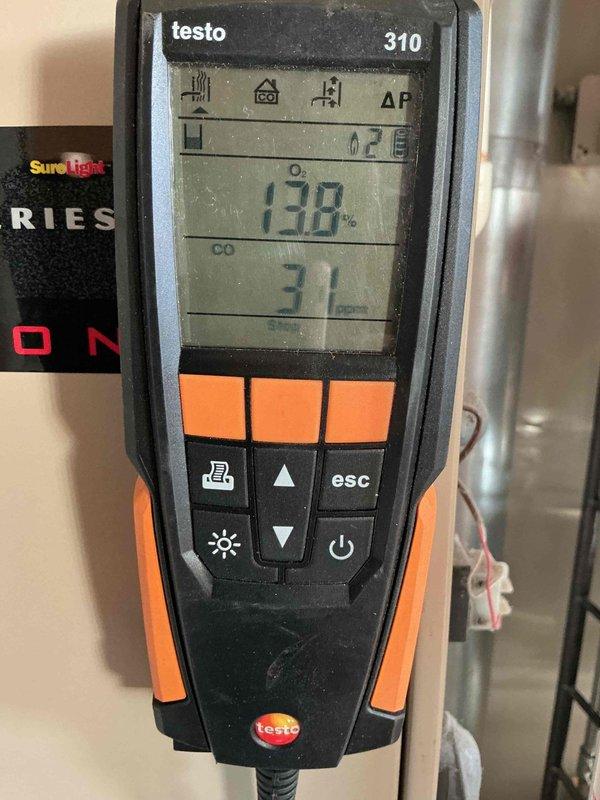 Performed comprehensive furnace maintenance service at client's daughter's residence. Conducted combustion analysis using Testo 310 analyzer, measuring oxygen levels (13.8%), CO readings (31 ppm), and efficiency parameters (EXA 10.0%). Installed new air filters as requested to complete the tune-up service.