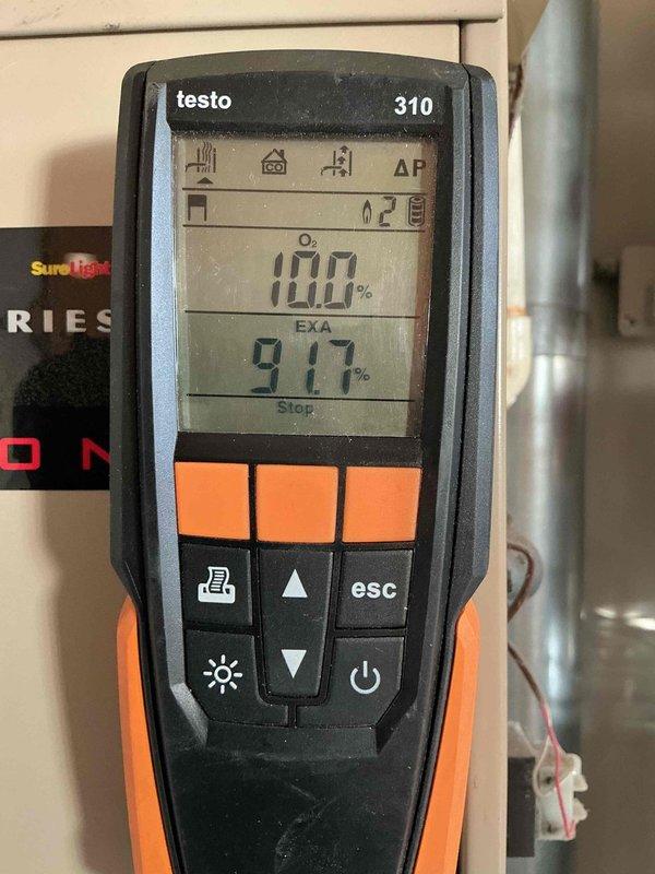 Performed comprehensive furnace maintenance service at client's daughter's residence. Conducted combustion analysis using Testo 310 analyzer, measuring oxygen levels (13.8%), CO readings (31 ppm), and efficiency parameters (EXA 10.0%). Installed new air filters as requested to complete the tune-up service.