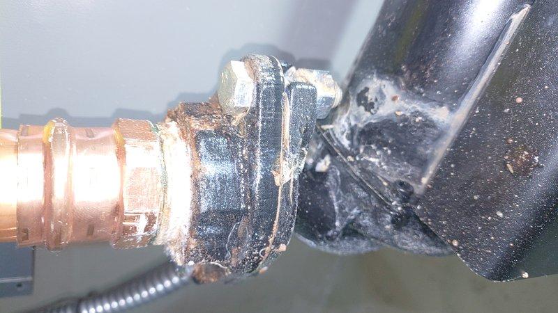 Responded to service call for recently installed furnace that was not operational and leaking water. Upon inspection, identified galvanic corrosion at the copper-to-steel pipe connection causing water leakage. Repaired plumbing connection with proper dielectric union to prevent further corrosion and restored system operation after addressing control board connections.