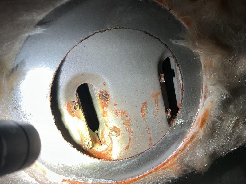Responded to no heat call for furnace of unknown age. Upon inspection, found significant corrosion and rust on heat exchanger with visible deterioration around burner assembly openings. Determined heat exchanger failure was causing system shutdown. Recommended replacement of heat exchanger or full system replacement based on severity of corrosion and safety concerns.
