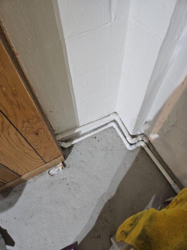 Responded to install callback to address multiple warranty items. Corrected HVAC installation issues including repositioning water heater to ensure proper clearance from furnace, installing expansion tank, routing condensate lines to sump pump, repairing humidifier control system, and securing termination boots on refrigerant lines. Also addressed structural concerns with cut joists and repaired filter rack to eliminate air leakage at the return.