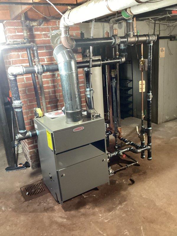 Successfully installed a 225kBtu steam boiler system in basement utility area. Completed comprehensive piping installation including exhaust flue, black PVC pipes, and copper supply lines with appropriate valves and fittings. System was properly connected to existing distribution network and verified for correct operation.