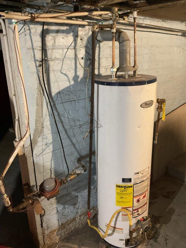 Conducted comprehensive AC replacement assessment, including inspection of the electrical panel capacity and circuit availability to ensure proper power supply for new system. Evaluated existing water heater installation and surrounding utility space to determine any potential interference with proposed AC equipment placement and ductwork routing.