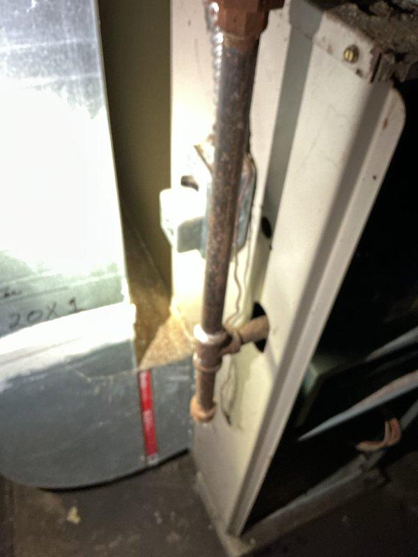 Responded to service call for water intrusion in furnace causing operation failure. Inspected system and found severely clogged air filter requiring replacement. Observed significant corrosion on copper pipe near furnace with water damage evident on surrounding components. Cleaned affected areas, replaced filter, and restored system to proper working condition.