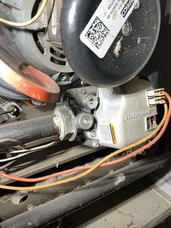 Responded to customer report of furnace cycling on and off prematurely. Inspection revealed significant dust accumulation on system components, including the Honeywell gas valve assembly and control board. Replaced severely clogged 20x20x1 air filter which was restricting proper airflow and causing the furnace to overheat and shut down as a safety measure.