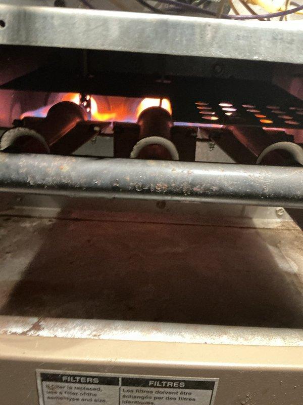 Replaced inducer motor, flame sensor, and pressure switch on furnace. Verified proper combustion with Testo analyzer showing good readings (CO: 4ppm, efficiency: 77.1%). System now operating with strong, even flame pattern across heat exchanger. Parts sourced from shop inventory.