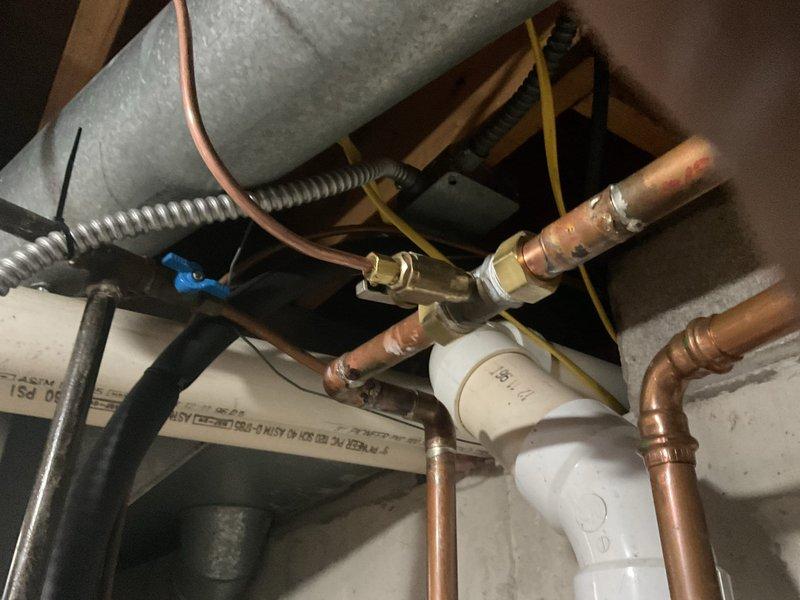 Conducted preliminary site assessment for humidifier installation. Documented existing plumbing infrastructure including copper supply lines and connection points for future unit placement. Photographed current HVAC system configuration showing ductwork where humidifier will be mounted. Installation pending customer availability in February.