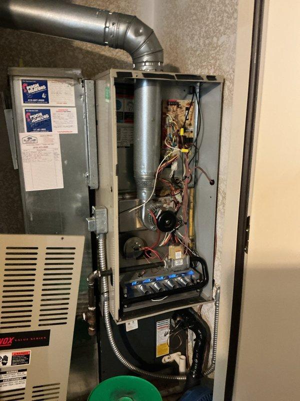 Diagnosed and serviced furnace that was not operating despite thermostat set at 72°F with ambient temperature in 60s. Removed front panel to inspect internal components including circuit board, wiring connections, and blower assembly, identifying and resolving the issue preventing proper operation. System now functioning correctly and maintaining desired temperature.