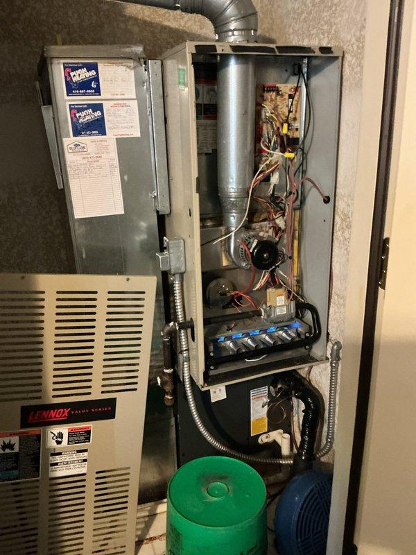 Diagnosed and serviced furnace that was not operating despite thermostat set at 72°F with ambient temperature in 60s. Removed front panel to inspect internal components including circuit board, wiring connections, and blower assembly, identifying and resolving the issue preventing proper operation. System now functioning correctly and maintaining desired temperature.
