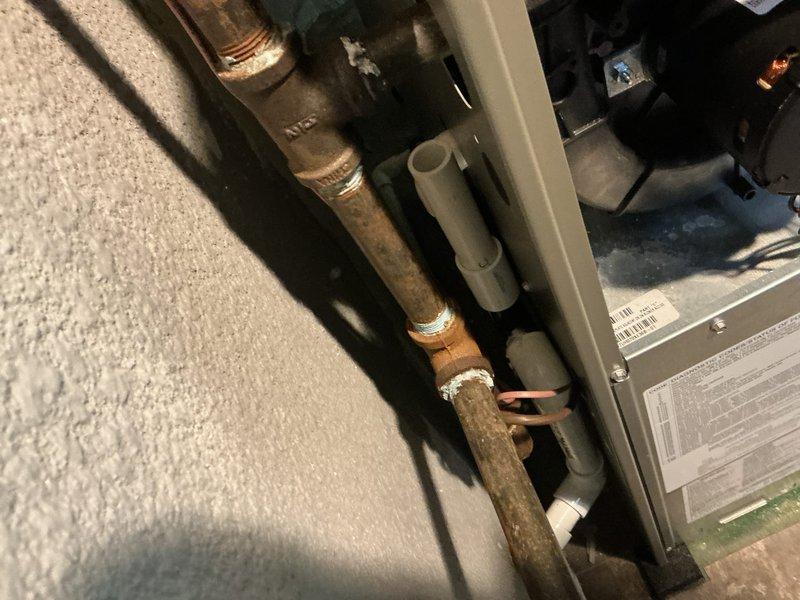 Performed routine maintenance on 2-year-old natural gas furnace (Lennox unit). Completed manufacturer's verified performance protocol, checking all connections, inspecting copper and PVC venting components, and verifying proper leveling of the system. Documentation photos taken of the main unit and associated plumbing connections.