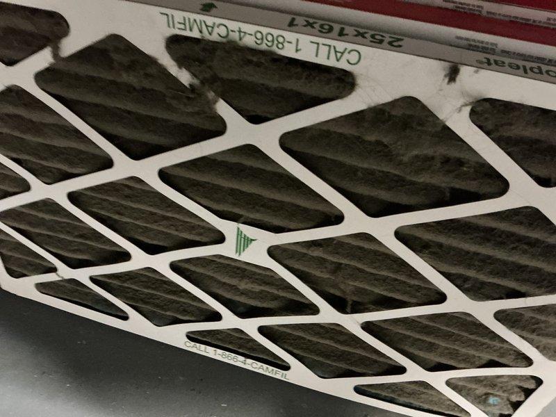 Performed routine maintenance on 10-year-old furnace. Replaced heavily clogged air filter (25x37x7) which showed significant dust accumulation. Inspected burner assembly and verified proper flame characteristics with normal blue coloration, indicating complete combustion and normal operation.