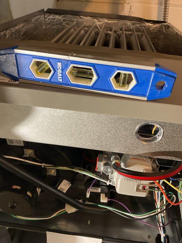 Successfully installed a high-efficiency 96% upflow 90kbtu furnace with proper leveling verified using bubble level. Installation required fabrication of a metal spacer to ensure correct positioning. Existing Nest thermostat was reconnected and system was tested for proper operation. All electrical connections were verified and system is functioning according to manufacturer specifications.