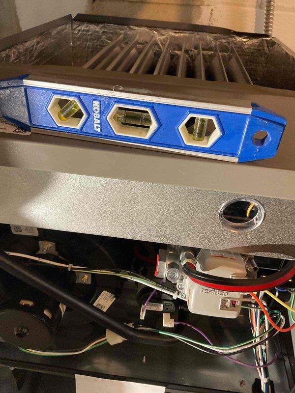 Successfully installed a high-efficiency 96% upflow 90kbtu furnace with proper leveling verified using bubble level. Installation required fabrication of a metal spacer to ensure correct positioning. Existing Nest thermostat was reconnected and system was tested for proper operation. All electrical connections were verified and system is functioning according to manufacturer specifications.